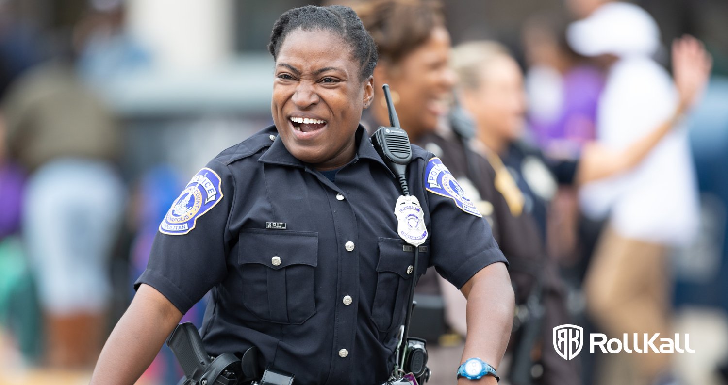 Smiling police officer working with off duty management 